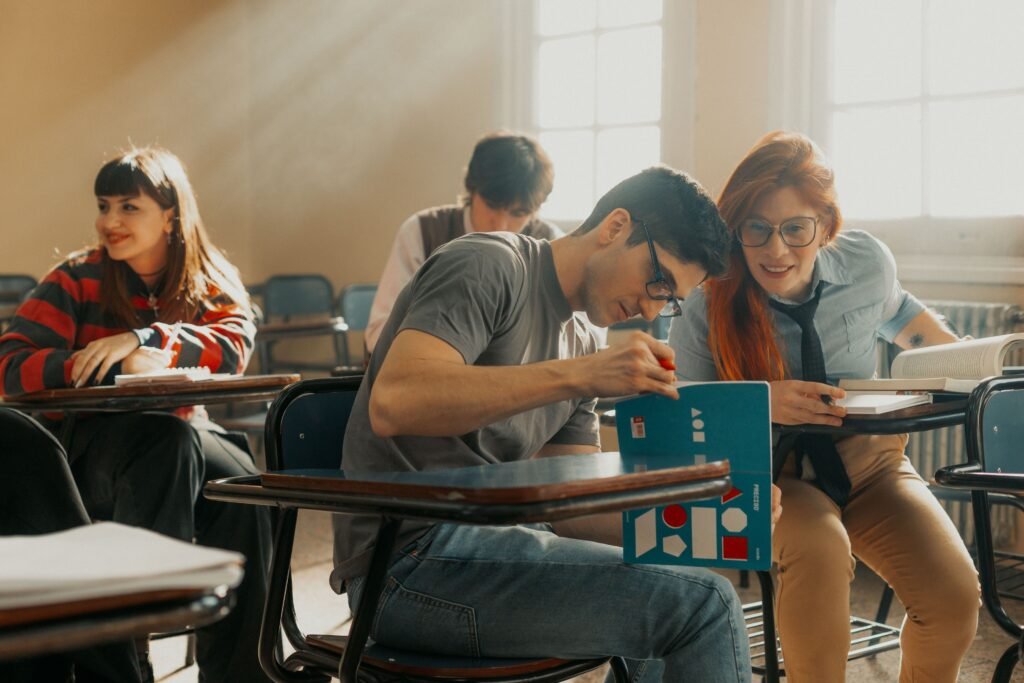 University students studying together in a sunlit classroom in Buenos Aires, Argentina.